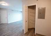 Thumbnail 6 of 17 - a bedroom with a closet and an open door
