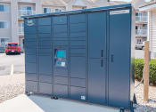 Thumbnail 12 of 17 - a lockers in a parking lot in front of an apartment building