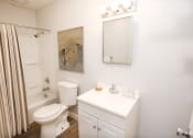 Thumbnail 13 of 18 - a bathroom with a sink toilet and shower