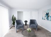Thumbnail 3 of 18 - a living room with two chairs and a coffee table