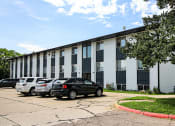 Thumbnail 18 of 18 - Facade and parking at East Edge Apartments