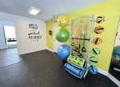 Thumbnail 22 of 31 - Eastland Apartments fitness studio with yoga balls