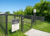 Thumbnail 13 of 31 - a fence with a sign on it in front of a dog park