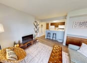 Thumbnail 1 of 30 - A living room with a fireplace and a couch.