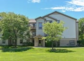 Thumbnail 21 of 28 - apartment community with shade trees