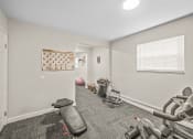 Thumbnail 12 of 24 - fitness center at apartment complex