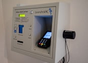 Thumbnail 11 of 25 - A laundromat value add center with a card reader and a phone.
