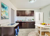 Thumbnail 11 of 28 - Kitchen and dining area with updated kitchen