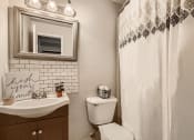 Thumbnail 7 of 28 - Primary Bathroom at Live on South Federal