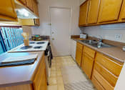 Thumbnail 6 of 32 - Apartment Kitchen with Dishwasher