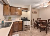 Thumbnail 4 of 30 - Apartment Kitchen with Appliances
