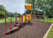 Thumbnail 19 of 30 - playground with a swing set at apartment