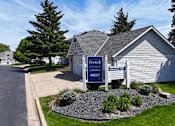 Thumbnail 29 of 34 - A sign for French Creek Townhomes West stands in front of a house.