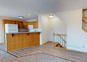 Thumbnail 3 of 34 - A kitchen with wooden cabinets and a white refrigerator.