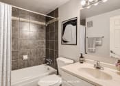 Thumbnail 6 of 20 - bathroom with mirror and bathtub