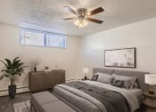 Thumbnail 5 of 20 - Bedroom with window and fan