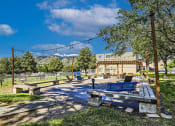 Thumbnail 16 of 20 - a picnic area with benches and a canopy