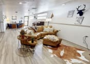 Thumbnail 10 of 20 - a clubhouse with a couch and a table