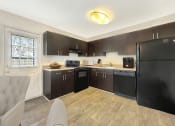 Thumbnail 1 of 17 - a kitchen with black appliances and a black refrigerator