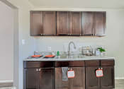 Thumbnail 12 of 28 - South Federal Apartment Kitchen with sink and cabinets