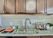 Thumbnail 13 of 28 - South Federal Denver apartment kitchen with updated sink in select units