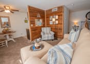 Thumbnail 9 of 20 - a living room with couches and chairs