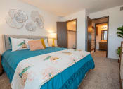 Thumbnail 6 of 20 - a large bedroom with walk-in closet and bathroom connected