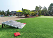 Thumbnail 23 of 30 - cornhole at Fox Hill Glens apartments