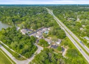 Thumbnail 23 of 23 - a aerial view of apartment community and a highway