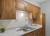 Thumbnail 6 of 23 - kitchen with cabinets and sink