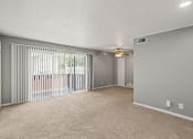 Thumbnail 3 of 23 - living room with sliding glass door to patio