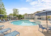 Thumbnail 18 of 23 - our apartments have a resort style pool and lounge chairs