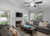 Thumbnail 1 of 24 - a living room with a couch and a tv