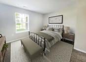 Thumbnail 8 of 30 - a bedroom with a bed and a window