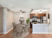Thumbnail 2 of 30 - an open kitchen and dining room with a table and chairs