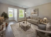 Thumbnail 4 of 30 - a living room with a couch and a table