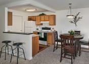 Thumbnail 20 of 30 - Beautiful open kitchen and dining area with breakfast bar in grand blanc, mi