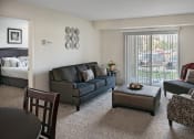 Thumbnail 19 of 30 - beautiful open living area with natural light and connected patio in grand blanc, mi