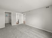 Thumbnail 16 of 30 - primary bedroom in apartment with walk-in closet and bathroom