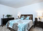 Thumbnail 10 of 30 - bedroom with a bed and two night stands