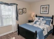 Thumbnail 11 of 30 - cozy apartment bedroom with carpeting
