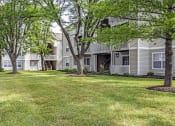 Thumbnail 27 of 30 - our apartments have green grass and shade trees