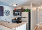 Thumbnail 1 of 30 - apartment kitchen with stainless steel refrigerator