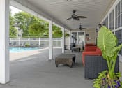 Thumbnail 20 of 30 - pool with covered patio at apartment community