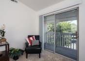 Thumbnail 6 of 30 - apartment living room with a sliding glass door to balcony