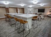 Thumbnail 17 of 37 - A conference room with a long table and chairs.