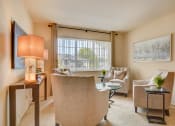 Thumbnail 5 of 16 - Living room with large window at the villages at general grant apartments