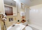 Thumbnail 7 of 22 - a bathroom with a sink toilet and bathtub