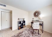 Thumbnail 5 of 22 - a home office with a desk and chair