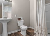 Thumbnail 16 of 27 - a bathroom with a toilet and a sink